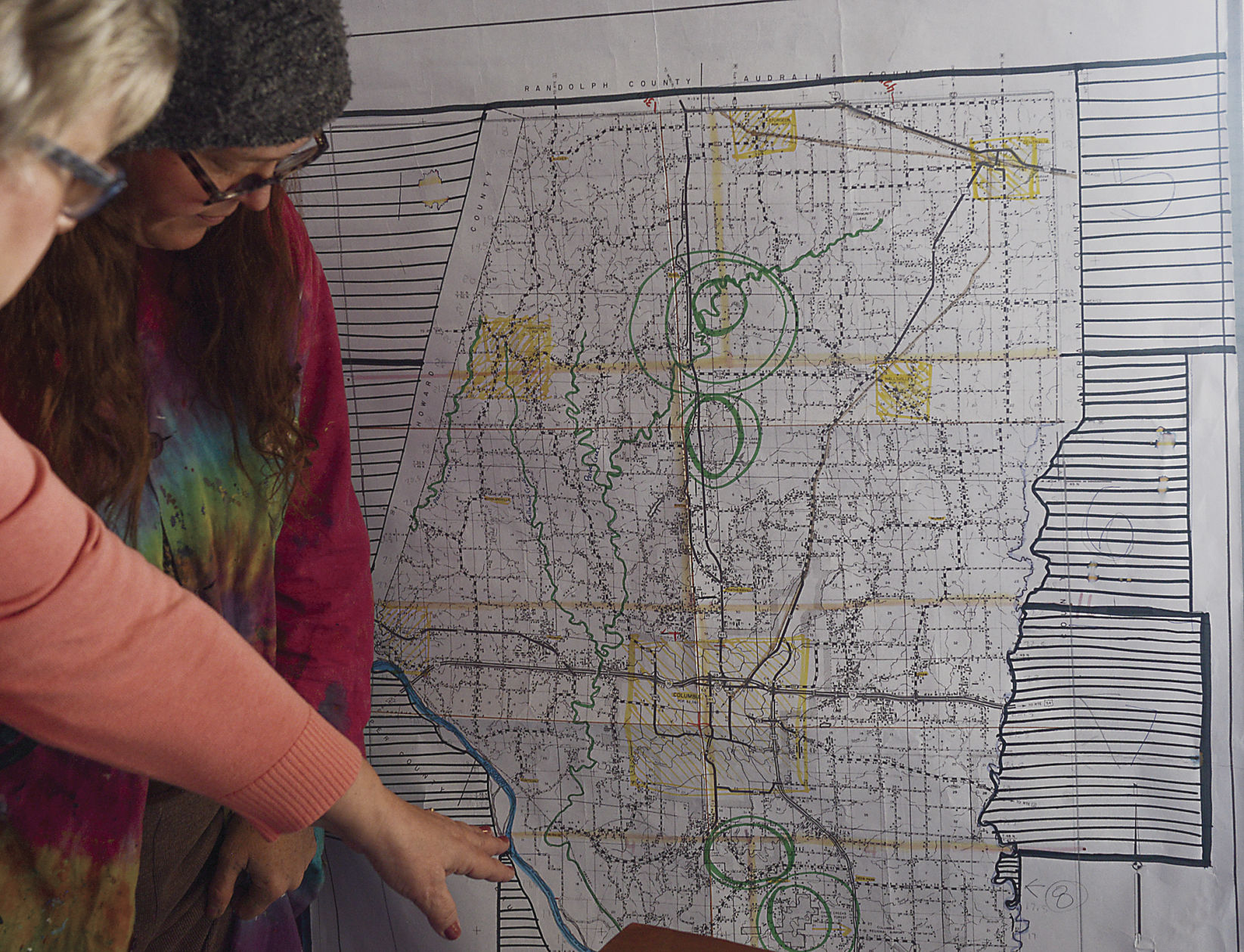 Stacy Self consults a map of the Boone County area
